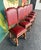 Masterfully carved oak frames with claw feet, ridged legs, red leather, and nailhead trim. This sextet has perfect...