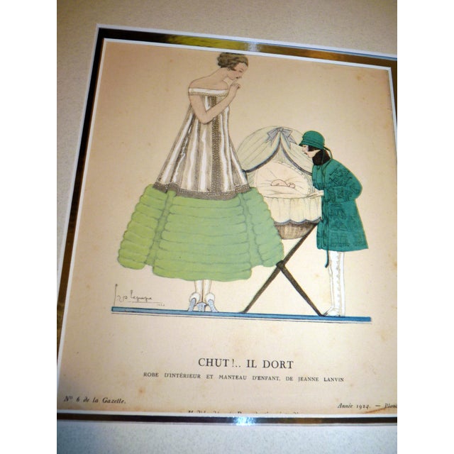 This exquisite original 1924 hand-colored pochoir, titled "Chut!.. Il Dort" (Hush!.. He is Sleeping), is a masterful...