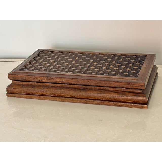 Vintage wooden jewelry box with the feel of chip-carved Tramp Art. Inside is compartmentalized and lined with red velvet....