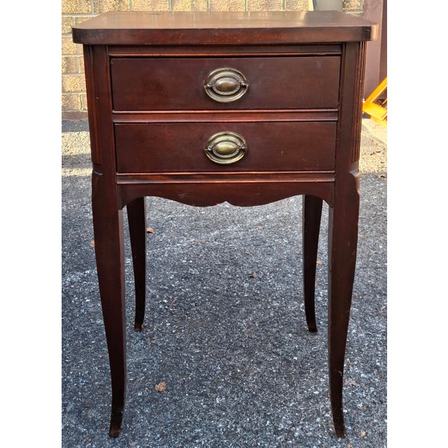 A Late 19th Century Eastlake Style Walnut and Marble Tip Oval Rolling Side Table. Dimensions: 17.5" in width, 14" in depth...