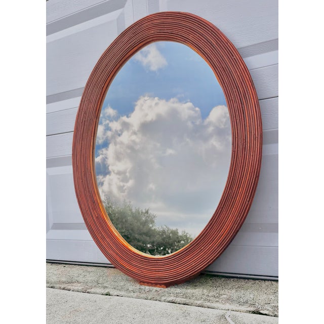 Mid-century modern oval rattan split reed wall mirror. Attributed to Gabriella Crespi. Hanging wire in place. See all...