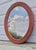 Mid-century modern oval rattan split reed wall mirror. Attributed to Gabriella Crespi. Hanging wire in place. See all...