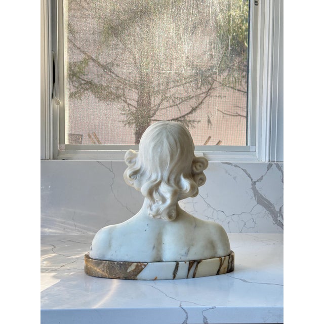 A marble bust that perfectly showcases what innocence looks like.