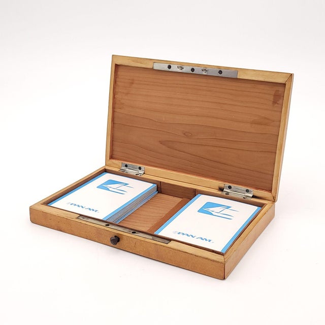 A vintage deck of Pan Am playing cards in a 19th-century French maple jet inset domed card box. Box has split to wood on...
