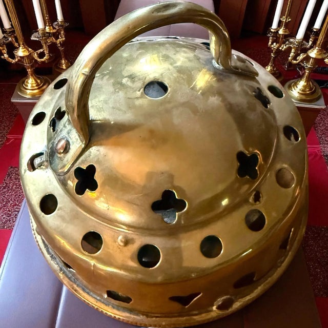 Identification • Material: Brass, hand-pierced with decorative cutouts (hearts, circles, quatrefoils). • Form: A domed...