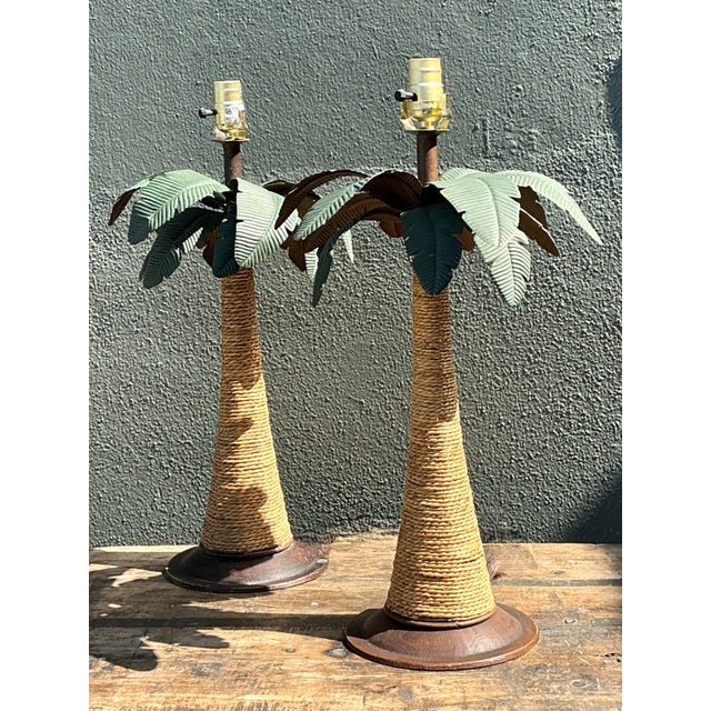 Capturing the whimsical essence of a sun-drenched retreat, this pair of vintage palm tree table lamps is a masterclass in...