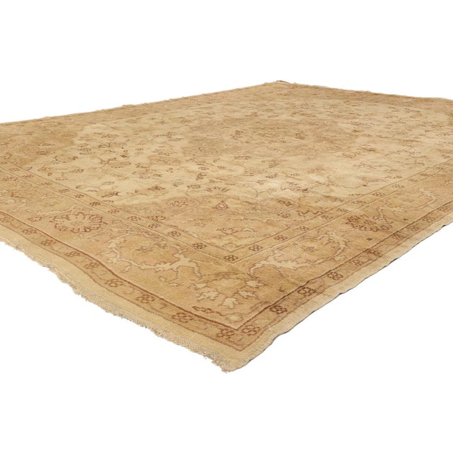 74056 Antique Neutral Turkish Oushak Rug, 10'04 x 13'10. Bathed in the golden hush of time, this hand-knotted wool antique...