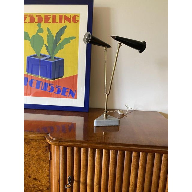 Mid-century table lamp Italy, 1960s Triangular grey marble base, brass, lacquered metal H 47 cm Diam. 25 cm Conditions:...