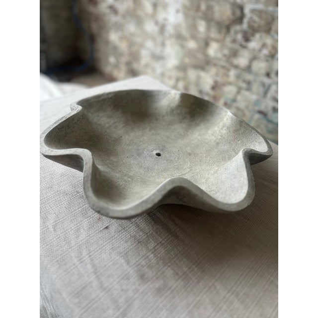 Elevate your space with this hand-formed concrete bowl, featuring soft undulating edges and an organic, petal-like...