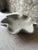 Elevate your space with this hand-formed concrete bowl, featuring soft undulating edges and an organic, petal-like...