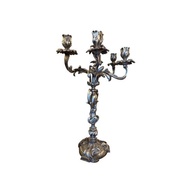 An impressive pair of French silver-plated bronze candelabras, dating to the 19th century. Each candelabrum rises from a...