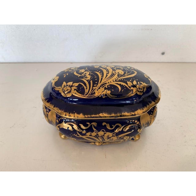 Pretty blue porcelain candy dish Gilt highlights with foliage decoration Bearing the M-Fres maker's mark (see photo) Good...