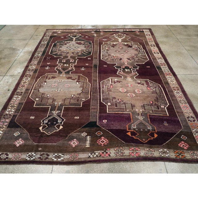 A vintage Turkish Anatolian tribal room size carpet handmade during the mid-20th century. Measures: 11' 0" x 14' 3"