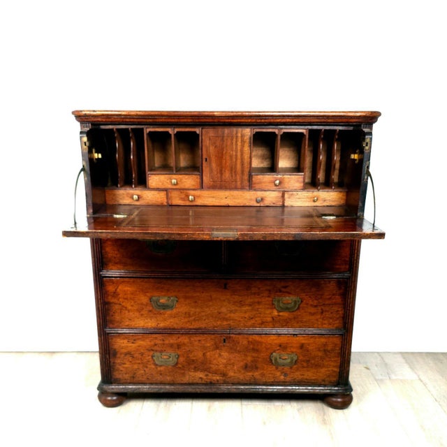 A 19th-century English campaign secretary-desk and chest of drawers.