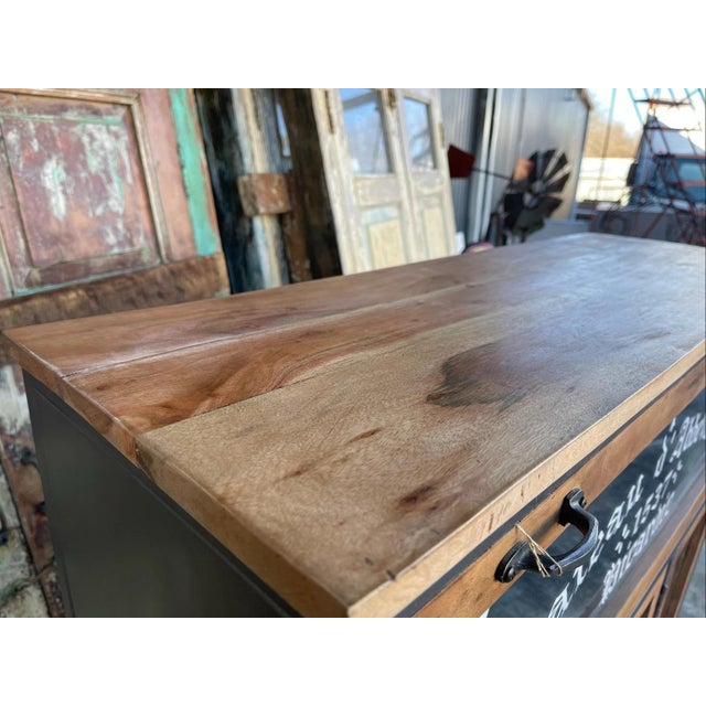 This industrial chic apothecary cabinet features a glass door and is crafted from tall, narrow rustic solid teak wood with...