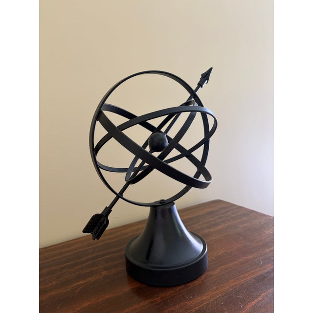 A beautifully crafted iron armillary sphere, evoking the timeless elegance of classical European gardens. Pieces like this...