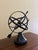 A beautifully crafted iron armillary sphere, evoking the timeless elegance of classical European gardens. Pieces like this...