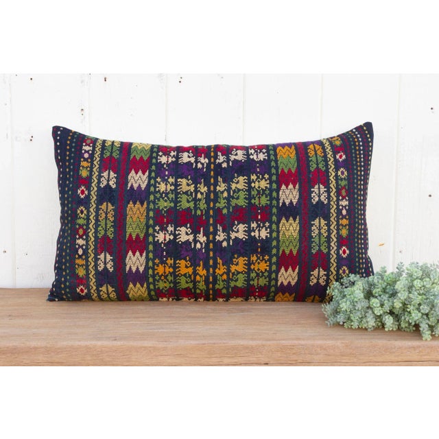 Originating from the Peruvian Andes, this captivating old Frazada pillow it's a unique piece brimming with history....