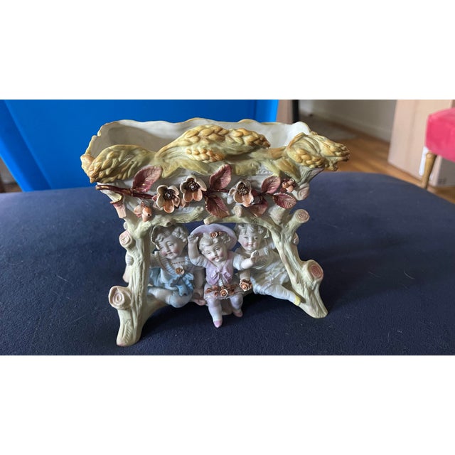 A well-matched lot of two antique bisque porcelain decorative pieces from the same estate collection, appraised at an...