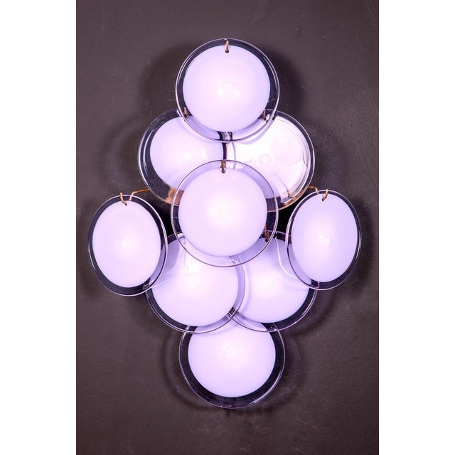 Pair of sconces with nine amethyst color vistosi discs, Murano glass. Up to 250V (Europe/UK Standard).The wiring of this...