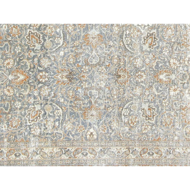 This lavish 1920s hand-knotted Persian Tabriz rug adds the perfect touch of elegance to any space. Its intricate design...