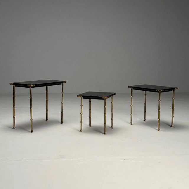 Jacques Adnet, French Mid-Century Modern, Nesting Tables, Leather, Brass, 1950s Set of three nesting tables designed by...