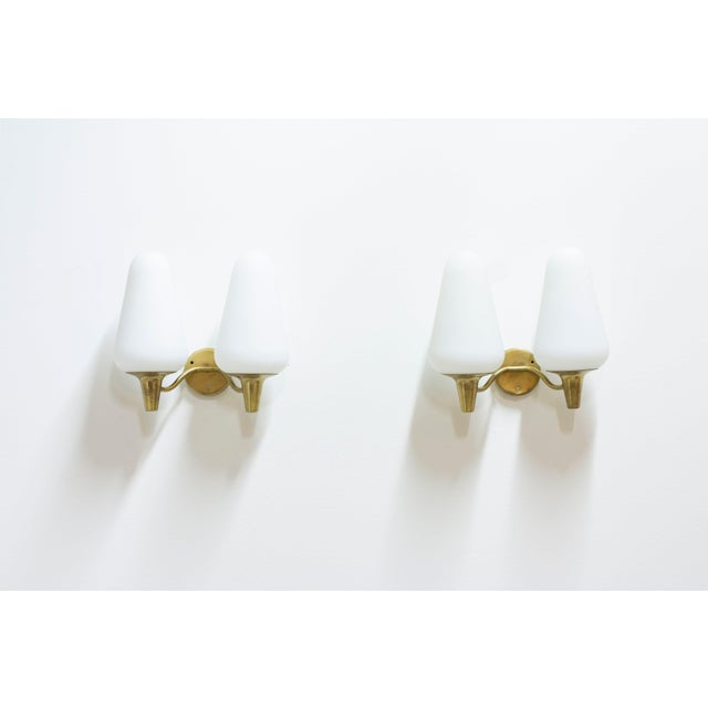 Wall lamps designed by harald elof notini. Produced by arvid böhlmarks lampfabrik during the 1950s. Made from brass with...
