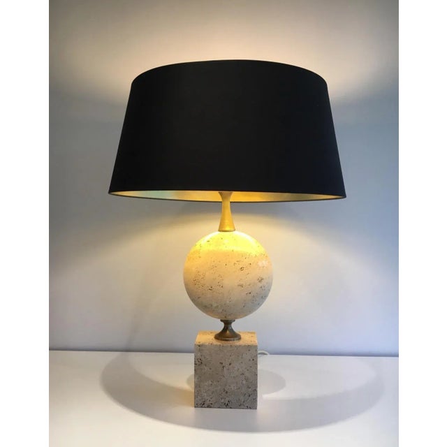 This beautiful and tall lamp is made of travertine and chrome. It is a very interesting model, not common by its size......