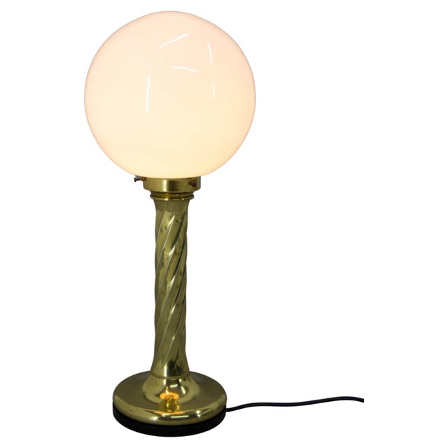 This big (height: 62cm, 24in) lamp could be used as floor lamp or table lamp. It has brass base and opaline glass shade....