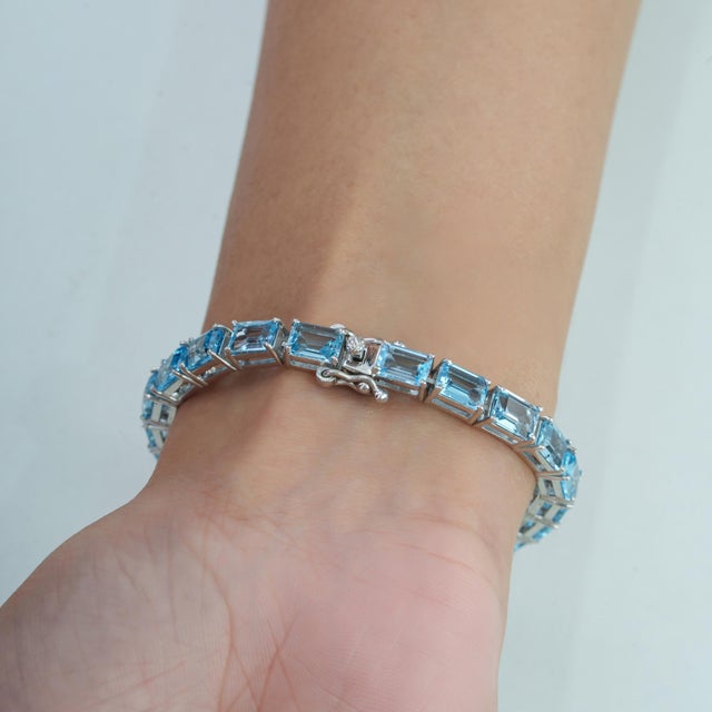 Blue Art Deco Style 26.1 Ct Emerald Cut Blue Topaz Line Tennis Bracelet in Sterling Silver For Sale - Image 8 of 12