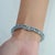 Blue Art Deco Style 26.1 Ct Emerald Cut Blue Topaz Line Tennis Bracelet in Sterling Silver For Sale - Image 8 of 12