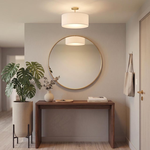 The Stretch Semi Flush Mount is a sophisticated lighting solution featuring a weathered brass steel body and a drum-shaped...