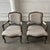 Design Plus Gallery presents a Pair of French Louis XV Style Striped Armchairs. The chairs showcase carved wood frames...