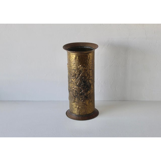 Arts and Crafts embossed repoussé design brass umbrella stand. The relief scene depicts an English pub or tavern setting...