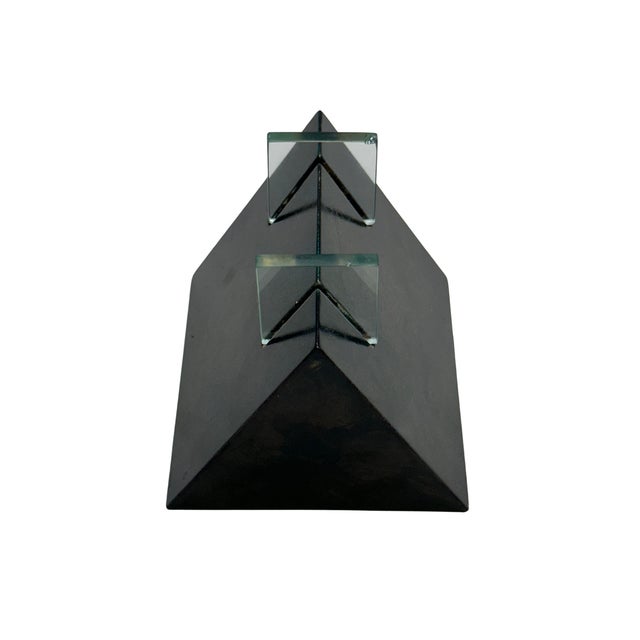 A striking sculptural object by Morin Choinière of Montréal, combining a substantial dark-finished wood form with two...