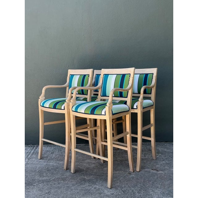 These four vintage bar stools combine carved nautical character with practical, durable seating. Each wood stool has a...