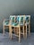 These four vintage bar stools combine carved nautical character with practical, durable seating. Each wood stool has a...