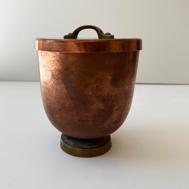 An unusual late 19th-century English copper ice cream mould or dessert pot, featuring a beautifully aged copper body,...