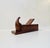 A late 19th or early 20th century decorative box or snuff box in the form of a woodworking tool, a plane. The lid part...