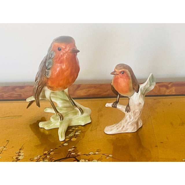 Antique German Goebel polychrome ceramic pair of Red Robin bird figurines on branches. glazed and unglazed,
