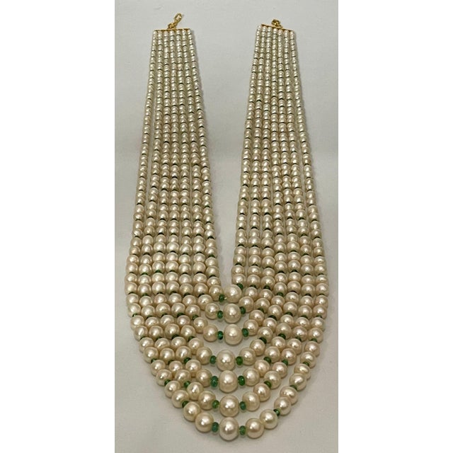 7 Layers of Fresh water Pearl with Emerald Beads with 14 Karat yellow gold Spacer clasp Opera Length Necklace The opera...
