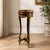 Elegant small French-style side table with a refined, slender silhouette and luxurious decorative details. The piece...