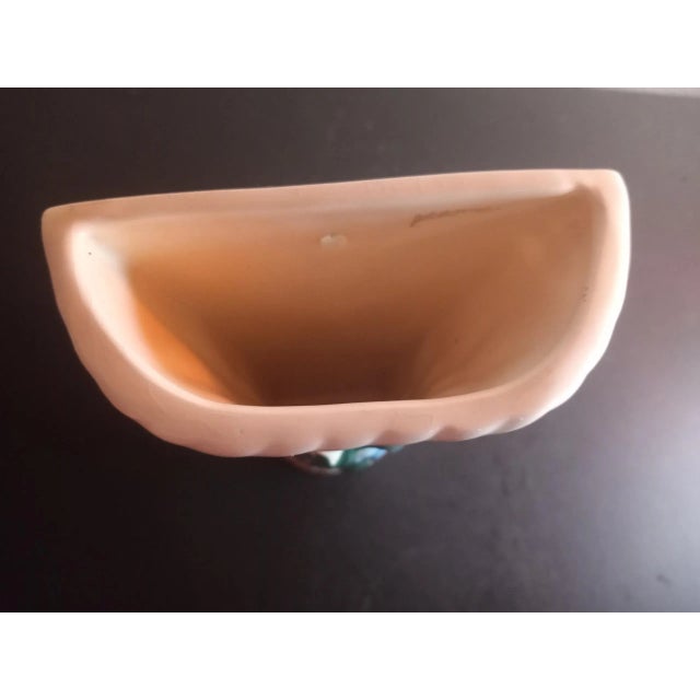 This is a vintage Ceramic Basket Weave with Floral 7" Wall Pocket Likely Italian. Procured at auction BOX 13