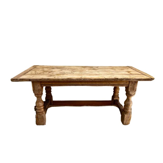 A French Farmhouse Table with turned legs, crafted from weathered oak for a rustic yet elegant look. Spacious and sturdy,...