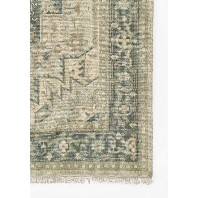 HAND KNOTTED: With the help of a hand knotted construction and natural wool fibers, this washed color palette and textural...