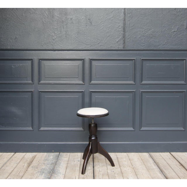 Height-adjustable piano stool. Solidly made of oak wood with a seat cushion that can easily be covered with fabric as...