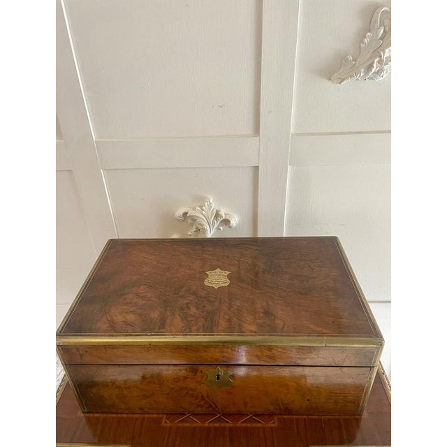 Superb quality antique Victorian burr walnut brass bound writing box having brass bounded corners and edges around a...
