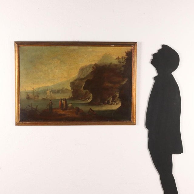 Oil on canvas.The coastal foreshortening, near a rocky inlet where torrential waters flow, shows figures at the landing of...