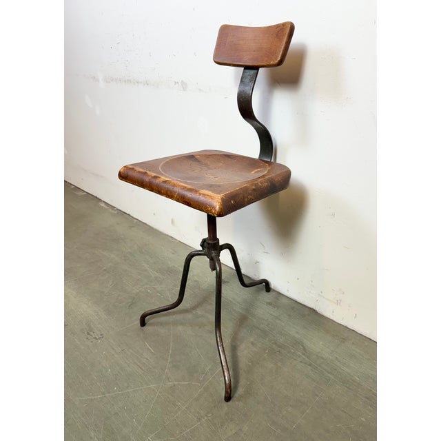 Industrial height adjustable swivel chair made in former Czechoslovakia during the 1950s.The construction is made of gray...