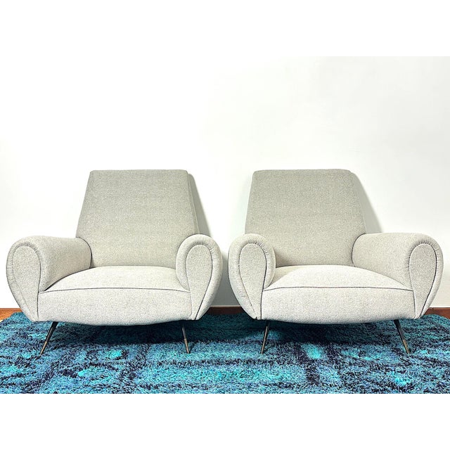 Extraordinary pair of 1950s armchairs by designer gigi radice, an icon of mid-century design. This pair perfectly embodies...